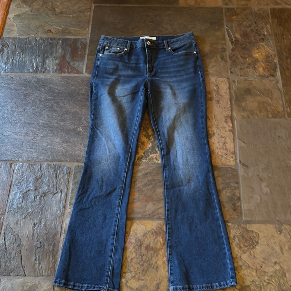 Size 10 denim jeans with crystal stub & button accents and animal print pockets.